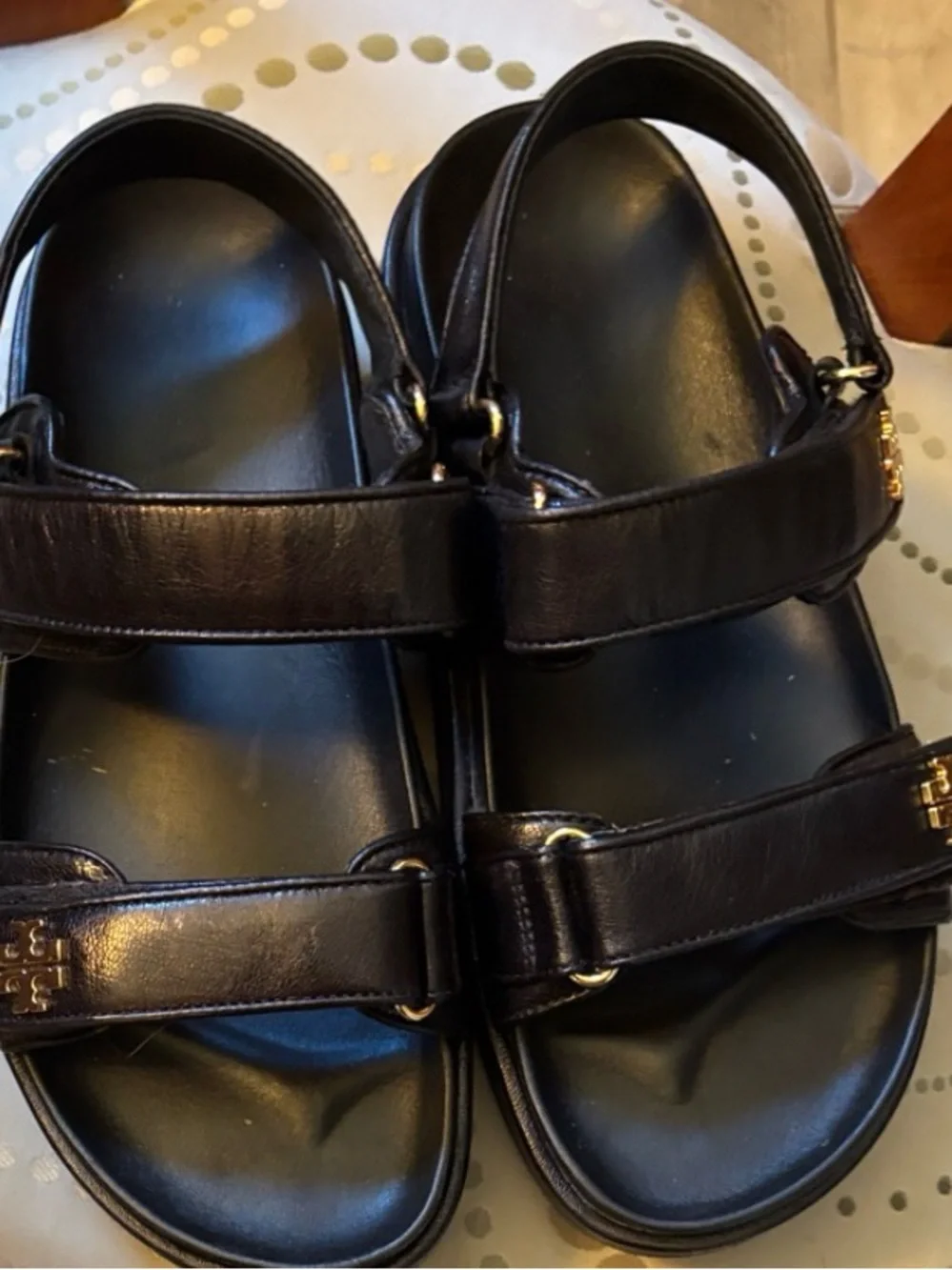 Tory Burch Kira women’s Black Leather Double-Strap Sandals with Gold Logo